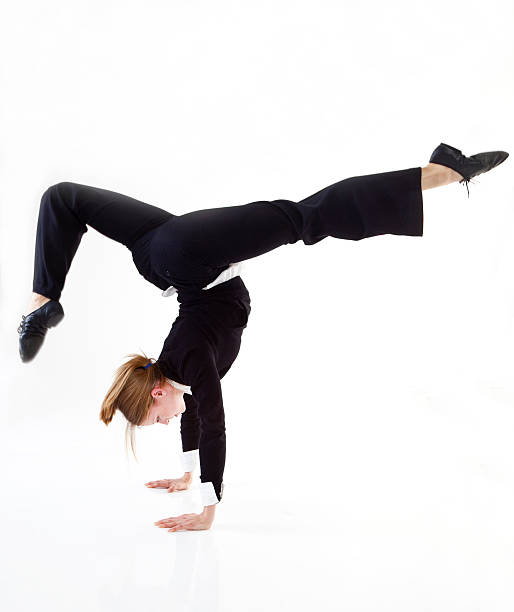 geschäftsfrau, die eine hand stand - flexibility business gymnastics exercising stock-fotos und bilder