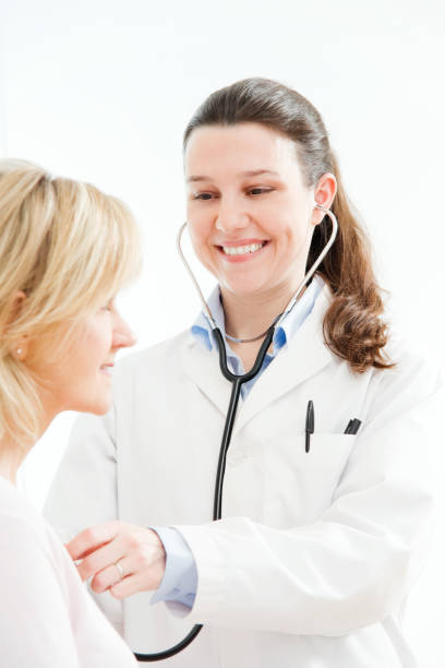 istock Doctor with Patient in Medical Office 157560733