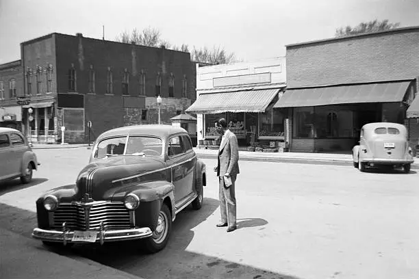 Photo of main street of small town USA with cars 1941, retro