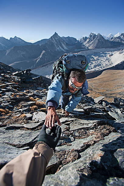 istock Nepali sherpa climbing in Himalayas 157561091