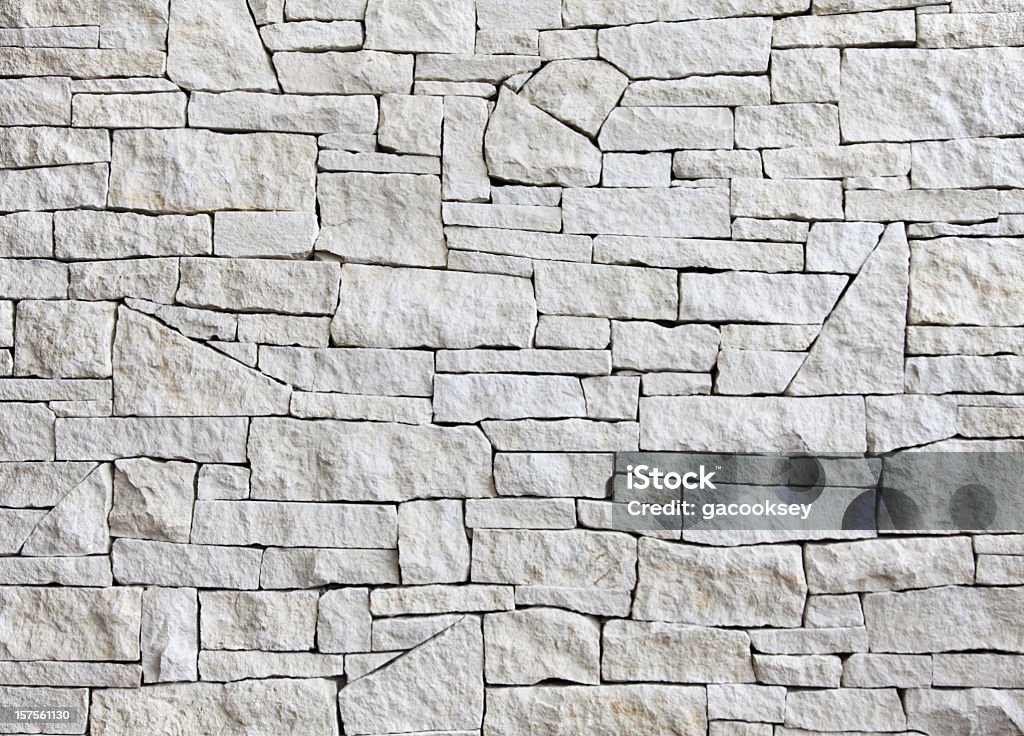 limestone wall - front view, many blocks Exquisite pattern of stacked limestone blocks on interior wall.  Stone Wall Stock Photo