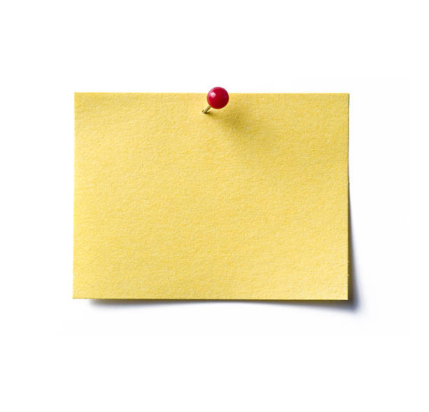 A Blank Yellow Sticky Note With A Red Pin Holding It Down Stock