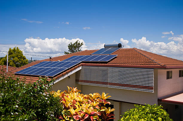 istock Solar Electricity and Hot Water System on house roof 157561399