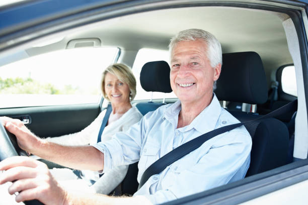 istock Happy older couple travelling by car 157561597