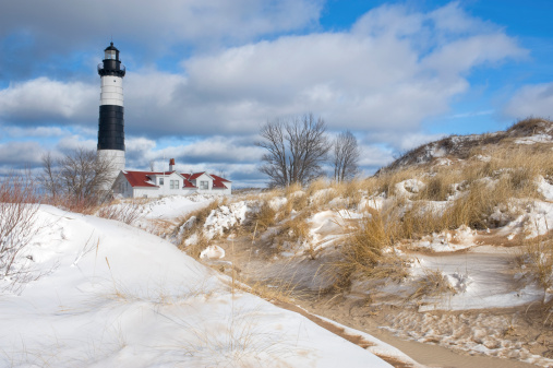 Saint Joseph Michigan lighthouse in winter ￼with snow and ice buildup.￼￼