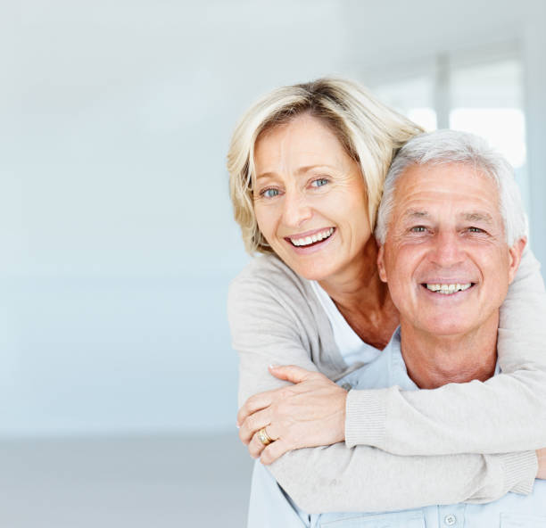 istock Happy mature lady hugging her husband from behind 157561781