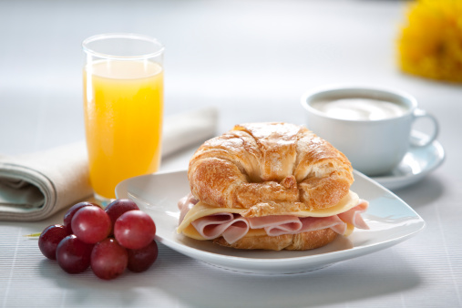 Croissant with cheese and ham.