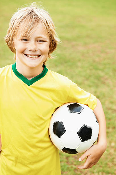 istock Boy holding a soccer ball 157561966