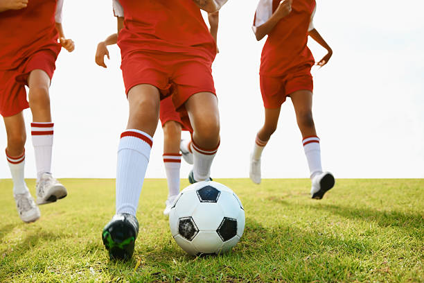 istock Children playing football 157562020