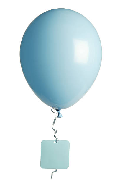 Three blue balloons photographed against a clear blue sky.