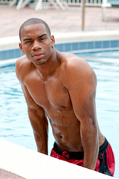 Handsome Young Man in a Pool. stock photo