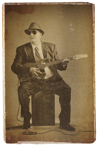 elegant senior playing an electric guitar