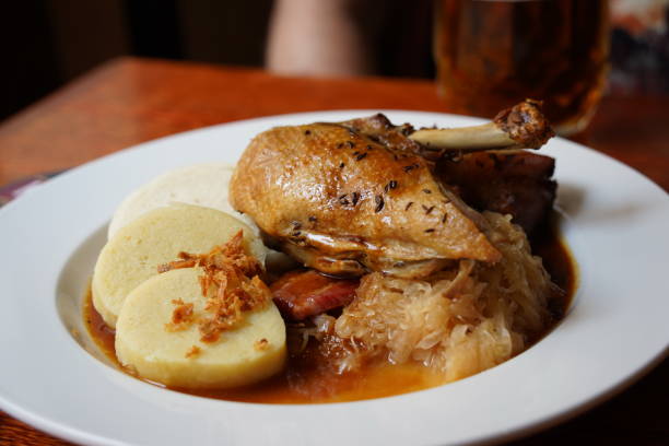 Baked duck leg with Czech dumplings and sauce. Traditional czech cuisine