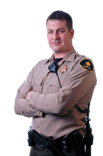 xerife com os braços cruzados - sheriff imagens e fotografias de stock