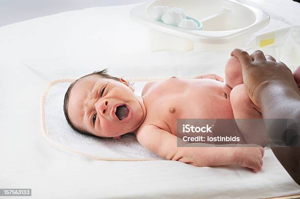 Changing A Newborn Babys Nappy Stock Photo - Download Image Now - Newborn, Changing Diaper, Diaper