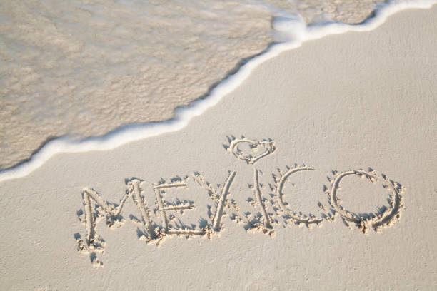 Riviera Maya, Mexico - Dec. 22, 2019: Beachgoers flock to the tropical beaches of Riviera Maya near Cancun, Mexico, during the popular Winter getaway to the Caribbean coast.
