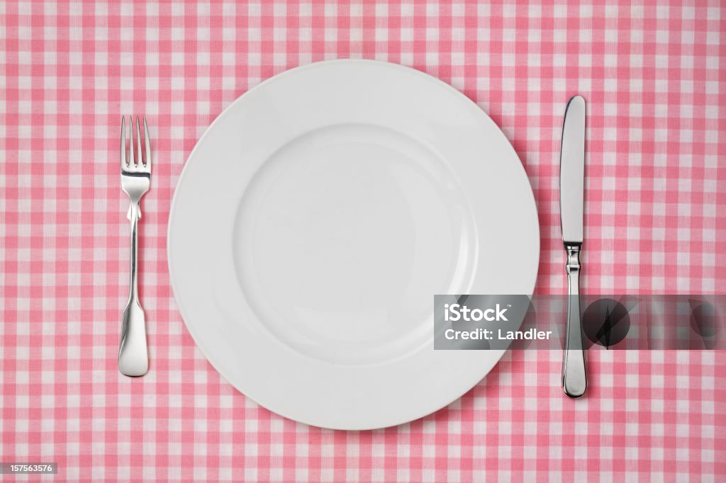 white plate on checkered tablecloth  Checked Pattern Stock Photo