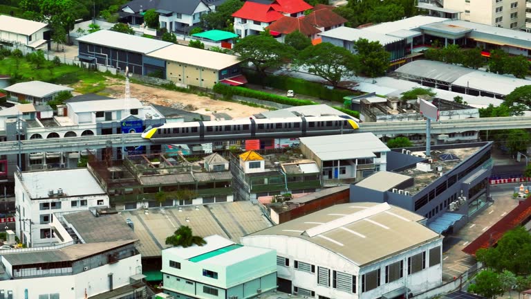 Drone Aerial View Train  running from the station(MRT Yellow Line) Lat Phrao Road