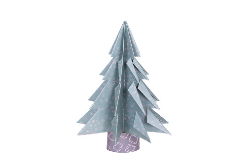 Handmade origami green blue paper craft pine Christmas tree on white background