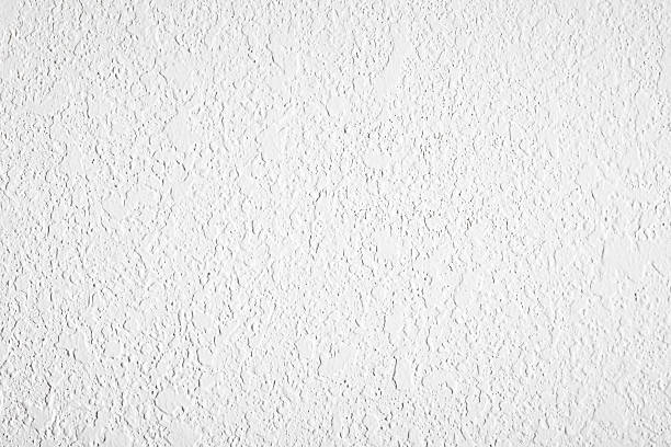 contraste de texture mur de plâtre blanc - stucco photos et images de collection