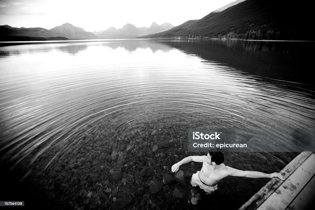 Swimming alone in a pristine mountain lake, Montana  Adult Stock Photo