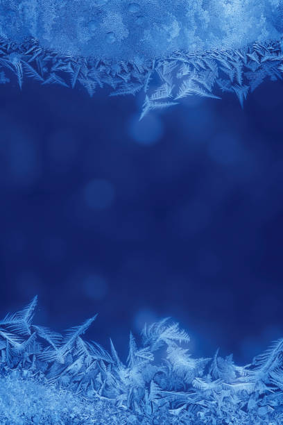 istock Winter night behind frozen window glass 157564274