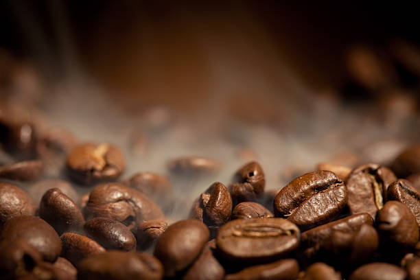 A close-up shot of steamy coffee beans stock photo