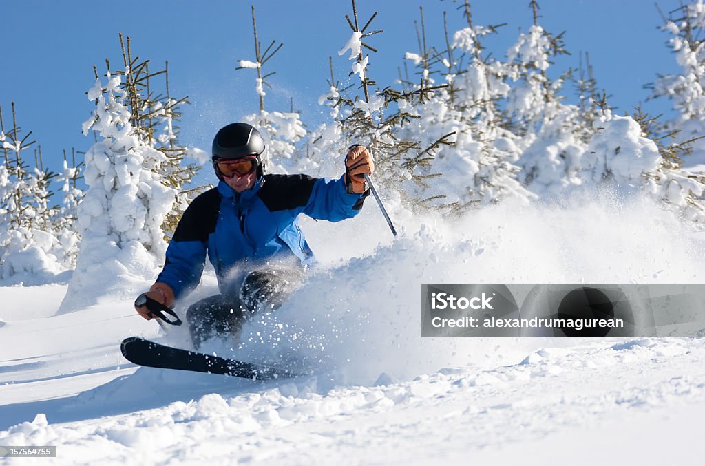 Skier  Carving in Fresh Powder Snow  Activity Stock Photo