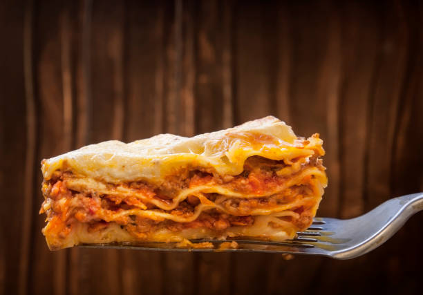 istock ready lasagna on the blade on a wooden background 1575649237