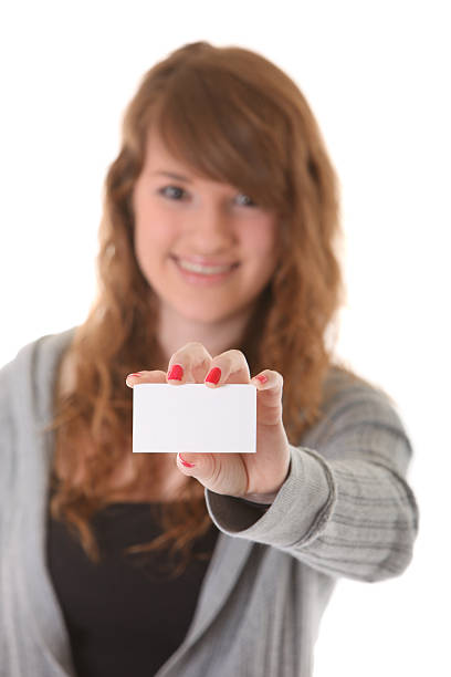 istock young woman with business card 157565194
