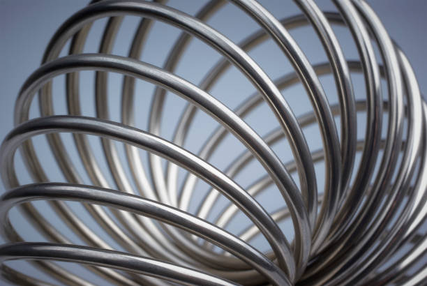 A close up shot of a metallic spring