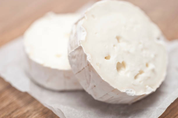Goats Cheese on wooden background with shallow depth of field