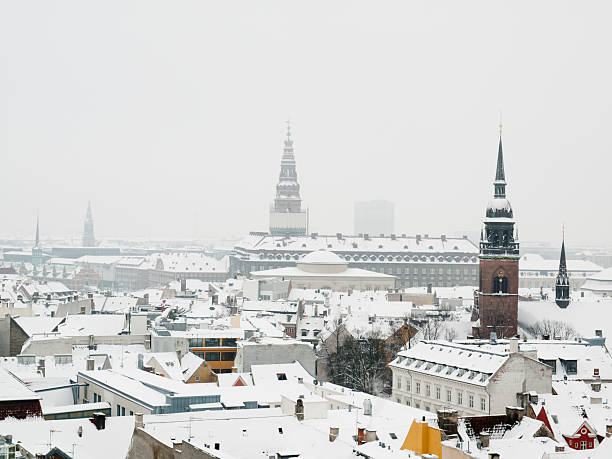 Looking over the snow covered roofs of Copenhagen stock photo