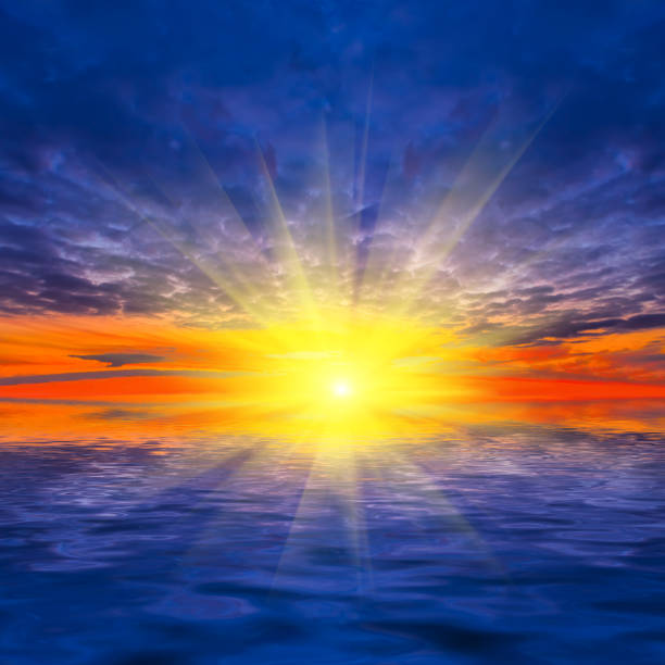 istock dramatic sunset over calm lake, sunset reflected in the water 1575653705