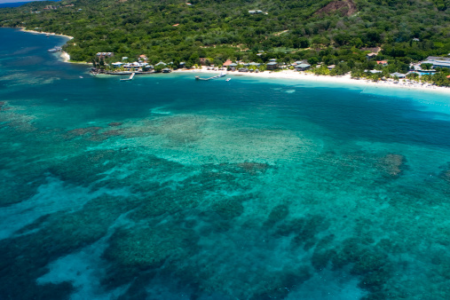 Aerial view of coral reef surrounding West Bay Beach on the island of Roatan, Honduras