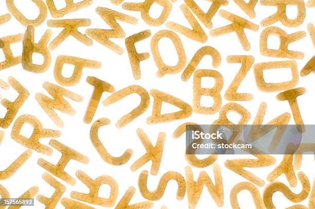 Alfabeto Letras De Pasta Sobre Fondo Blanco Foto de stock y más banco de imágenes de Grano - Planta - Grano - Planta, Letra del alfabeto, Abstracto