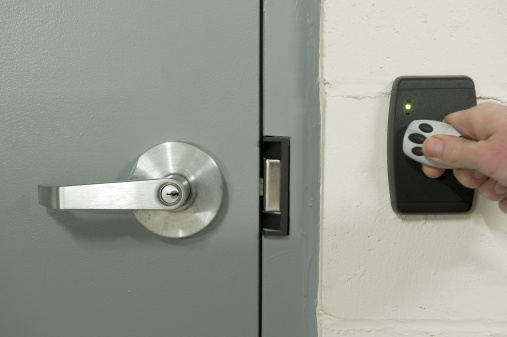 Opening a security door with a touch pad and fob