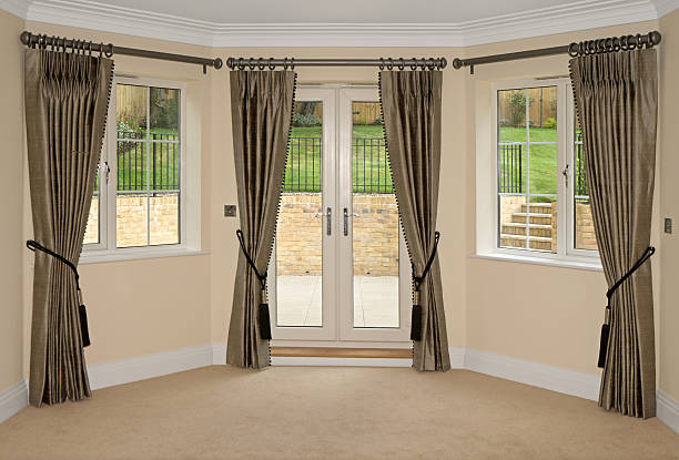 istock silk curtains and bay windows 157566094