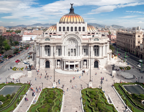 Cityscape of downtown Mexico City with the Palacio de Bellas Artes on a sunny day.