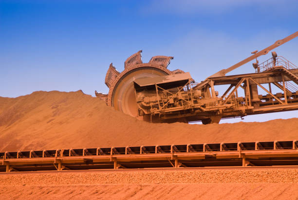 Reclaimer on Iron Ore Mine Site Iron Ore Mine Site Port Hedland Western Australia Reclaimer stock pictures, royalty-free photos & images