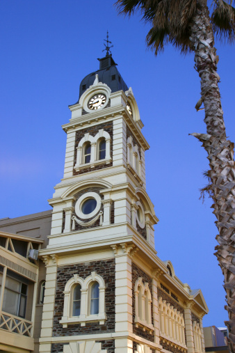 View looking up at Glenelg Town Hall with bright sky in background