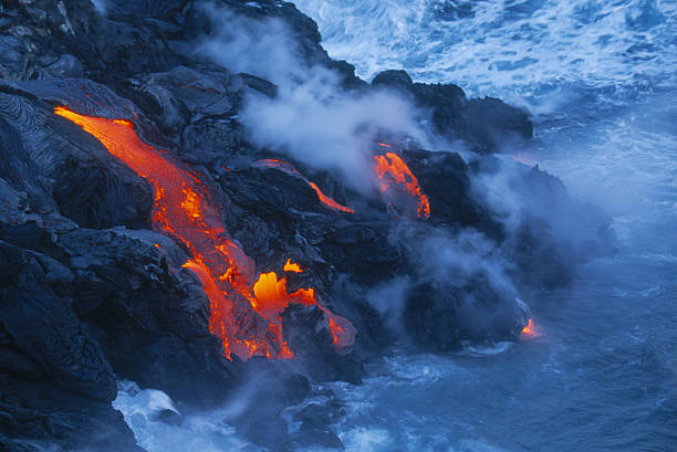 istock Lava flow in Hawaii flowing into the ocean 157567664