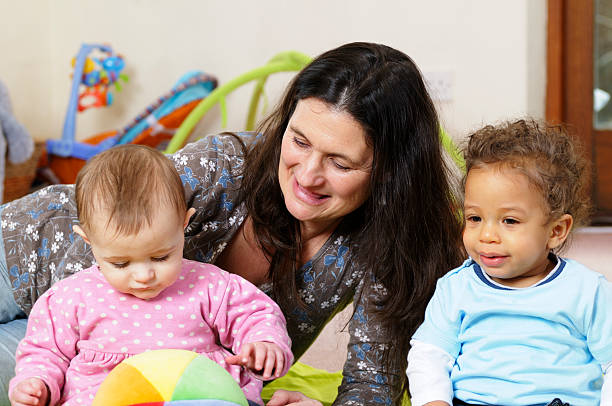 istock Caucasion Woman Enjoying Playtime With Babies 157567704