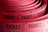 Close up of roll of pink ticket stubs