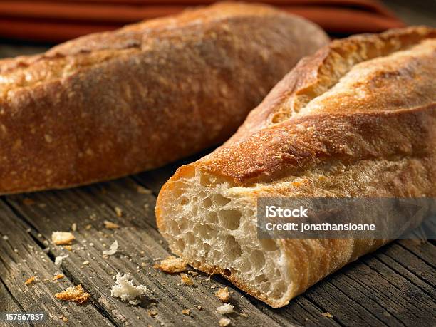 Baguettes With Crumbs On Weathered Background Stock Photo - Download Image Now - Baguette, Bread, Italian Culture