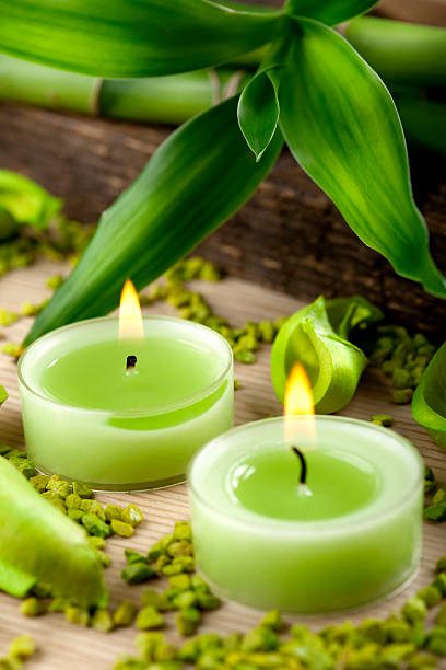 istock Green lit candles and bamboo decoration 157568391