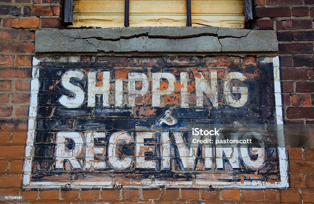 Shipping and Receving Sign Shipping and receiving painted sign on brick wall of run down warehouse/ factory in downtown Detroit Detroit - Michigan Stock Photo