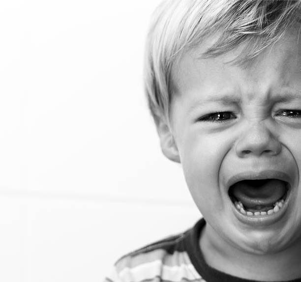 istock Black and white portrait of a crying young boy 157568607