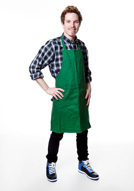 istock smiling man wearing green apron 157568641