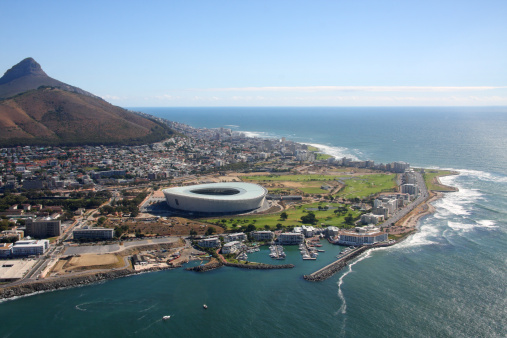 Flying over the new Cape Town Stadium at Green point close to the Victoria & Alfred Waterfront.